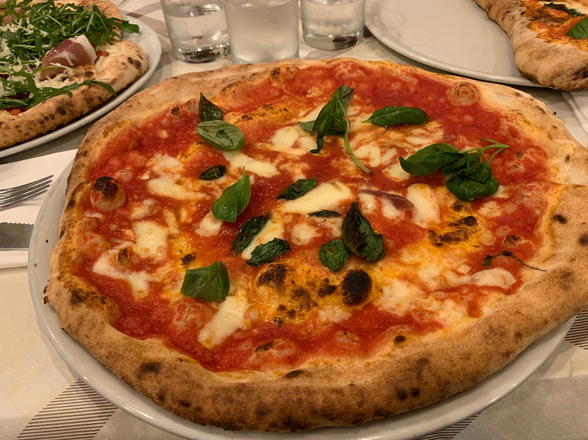 traditional Neapolitan pizza - tomatoes, basil and mozzarella